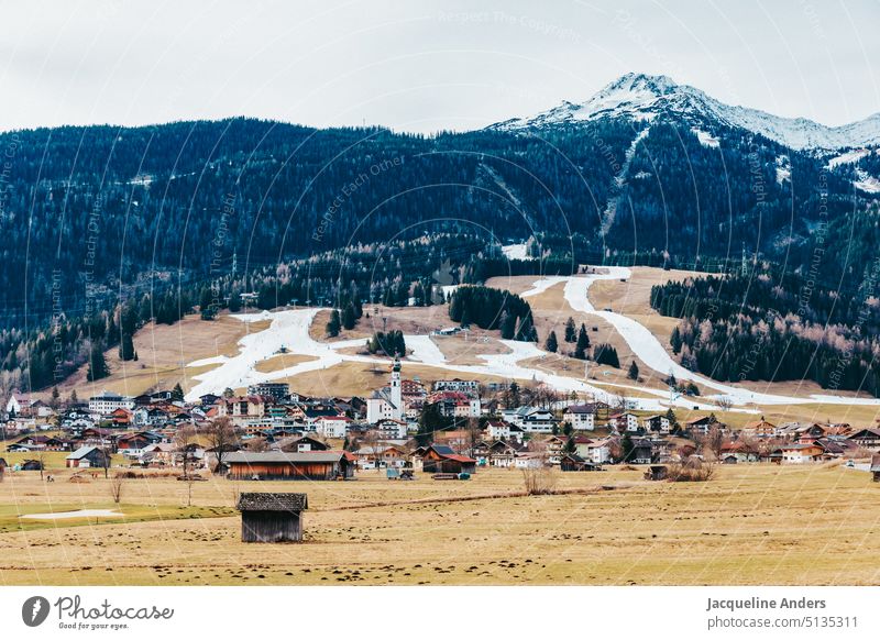 View of the village and ski resort Lermoos in winter with snow only on the ski slopes Austria Skiing Ski run Winter Snow snow-covered Mountain Alps