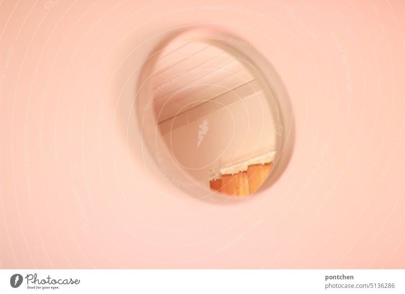 a round, white vintage mirror on a white wall. wooden ceiling and curtain are reflected in it. living. minimalism Mirror dwell Arrange Minimalistic White Drape