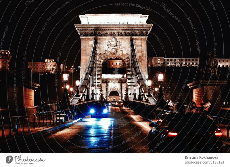 View to Chain bridge and city traffic. Beautiful evening or night scene of illuminating ancient architecture. autumn baroque blur effect budapest building