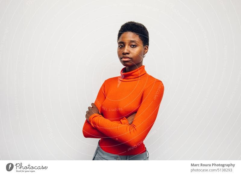 black woman person wearing a red shirt on a white background african afro american angry annoyed arms attractive beautiful businesswoman casual confident cool