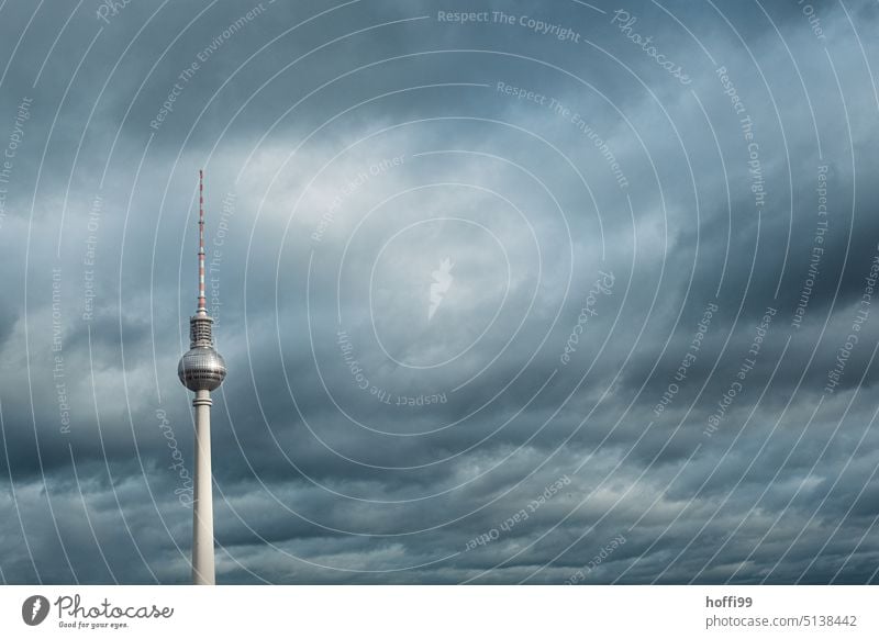 Berlin TV tower against dramatic cloudy sky Berlin TV Tower television tower Capital city Landmark Television tower Alexanderplatz Downtown Berlin