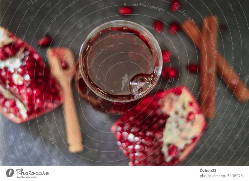 Çay with cinnamon sticks and pomegranate seeds Tea Cay Hot Hot drink Pomegranate Cinnamon Cinnamon sticks Beverage Cup Colour photo Drinking Food Healthy