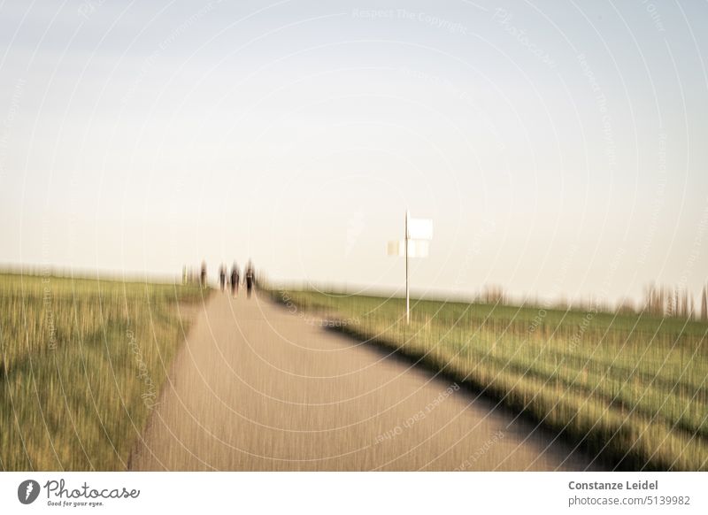 Stroller on dirt road in ICM technique ICM technology Unclear Peaceful Calm hazy abstract photography tranquillity Long exposure Horizon blurred vibrating