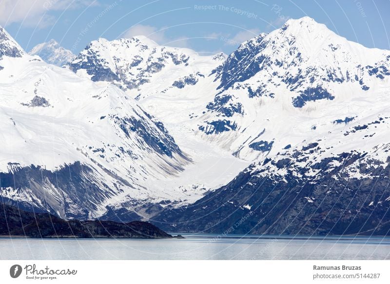 Glacier Bay National Park Snowy Mountains With A Small Glacier view scenic nature north cold bay water shore coast coastline mountain snow glacier ice peak