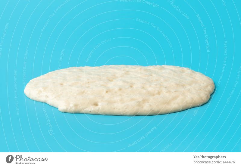 Bread sourdough isolated on a blue background. Active sourdough close-up active bakery baking bread bright bubbles color concept cooking cuisine diet ferment