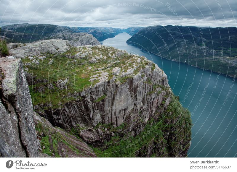 View of a rock and a fjord in Norway. Fjord Rock Mountain Water Clouds Scandinavia Vacation & Travel Landscape Nature Colour photo destination Relaxation