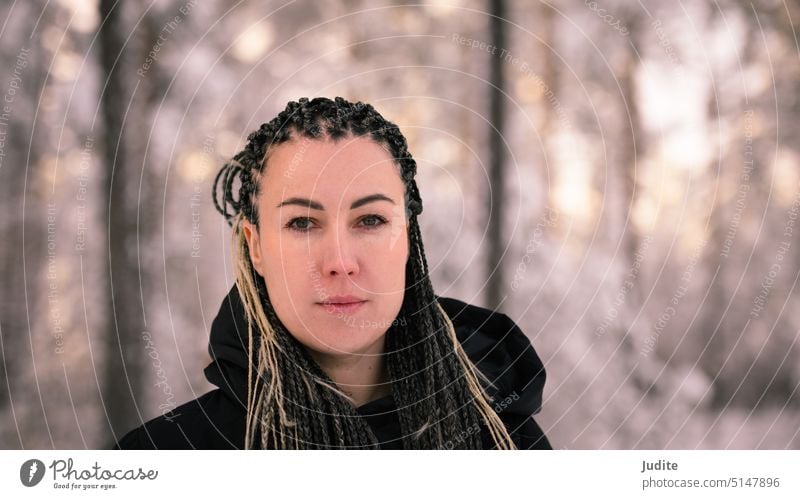 Young woman with African braids in natural winter environment landscape adult attractive beautiful beauty braided braided hairstyle candid carefree caucasian