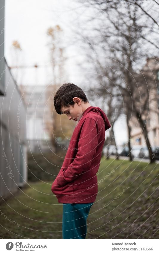 Portrait of a 9 year old boy looking sad Boy (child) young boy Portrait photograph Sadness depressed depression childhood trauma alone upset Profile unhappy