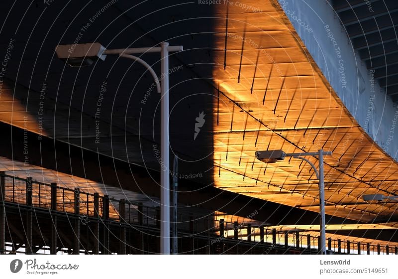 Sunset with golden light and hard shadows on the Rainbow Bridge in Tokyo, Japan sunset Shadow Shadow play bridge dusk evening street light tokyo tokyo bay