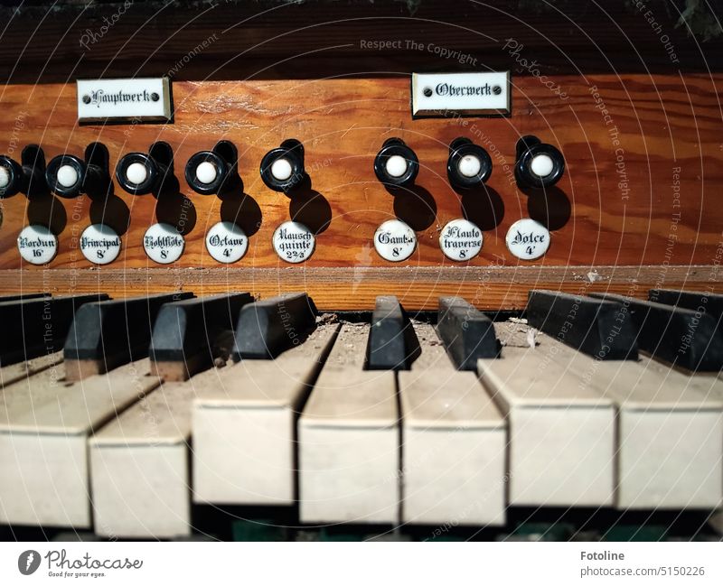 Detail of an old organ. There is dust and dirt on the keys. It's been a long time since the keys were banged. detail Organ Musical instrument Make music