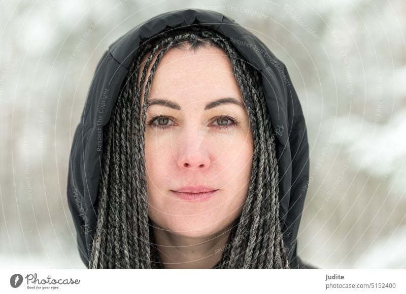 Young woman with African braids in natural winter environment landscape adult attractive beautiful beauty braided braided hairstyle candid carefree caucasian