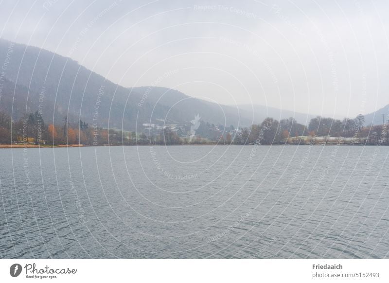 Reservoir landscape in winter gray Lake mountains Gray Winter mood Landscape Nature Water Sky Clouds Exterior shot Environment Deserted tranquillity silent