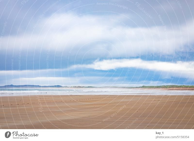 Beach panorama in Ireland wide coast Ocean Clouds Blue sky Vacation & Travel Freedom Wanderlust Waves Sky Nature Relaxation Exterior shot Longing Idyll Tourism