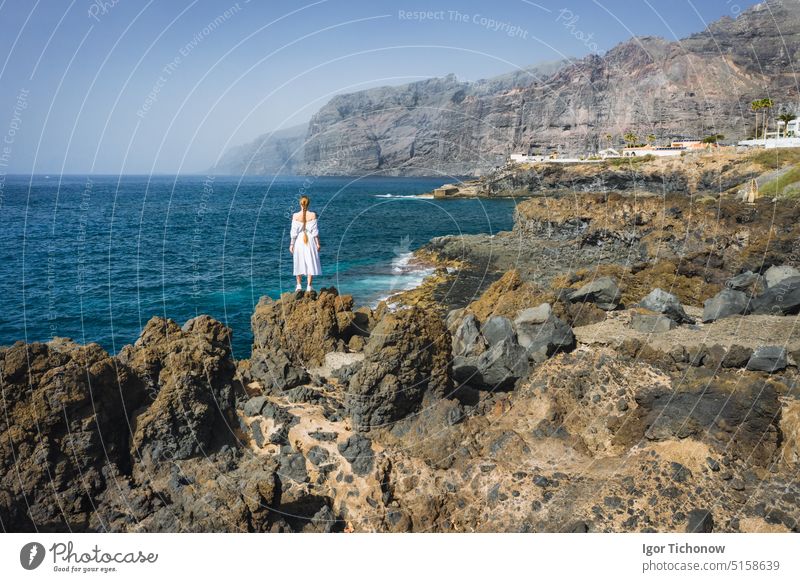 Beautiful girl enjoying the coast in giants beach in Tenerife. Cliffs of the los gigantes. Tenerife, Canary Island, Spain young atlantic tenerife canary island