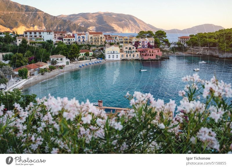 Assos town on Cephalonia Ionian island in Greece. Summer travel vacation assos greece village summer colorful boat luxury yacht cephalonia beach view bay water