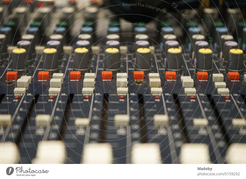 Old mixer with many colorful controls for sound, disco and concert in a store in the Bosch Straat in the old town of Maastricht on the Meuse in the province of Limburg of the Netherlands