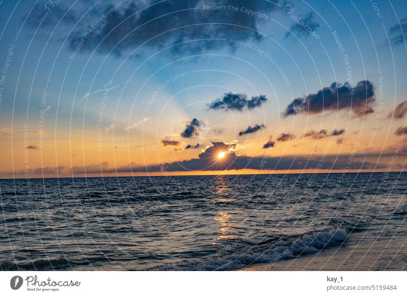 Sunset on beach with waves Ocean Beach Water Evening Waves Dusk Vacation & Travel Clouds coast Sky Light Landscape Blue Horizon Orange Sunlight Sylt North Sea