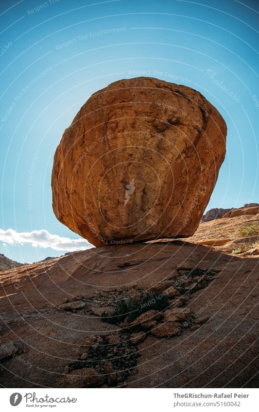 Big stone on a rock against blue sky Namibia Steppe Landscape Exterior shot Nature Deserted Environment Far-off places namibia road trip Africa Freedom stones