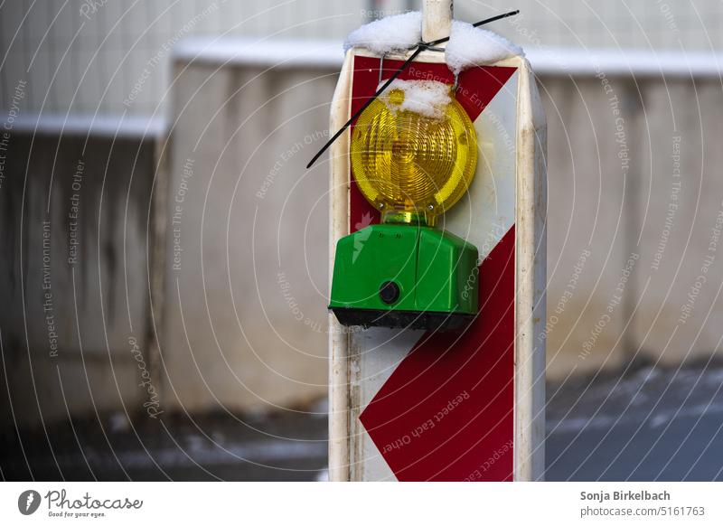 Cold light - construction site beacon in snow Construction site Lamp Light Countdown marker Exterior shot Deserted Street Signs and labeling Colour photo Red