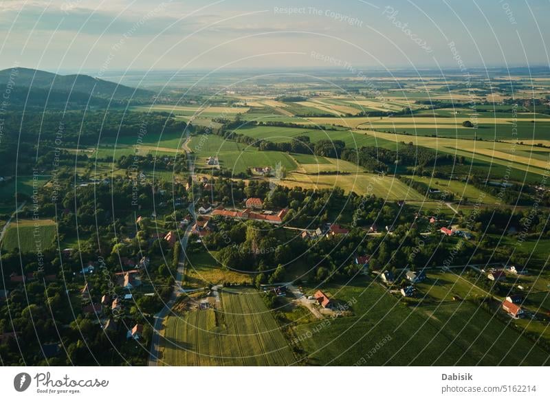 Aerial view of countryside area with village and mountains overhead poland landscape rural aerial valley agriculture environment field forest green hill nature