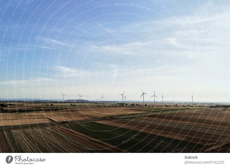 Windmill turbines in countryside. Sustainable wind energy concept windmill farm sunset alternative energy generation sunrise generator factory sunlight