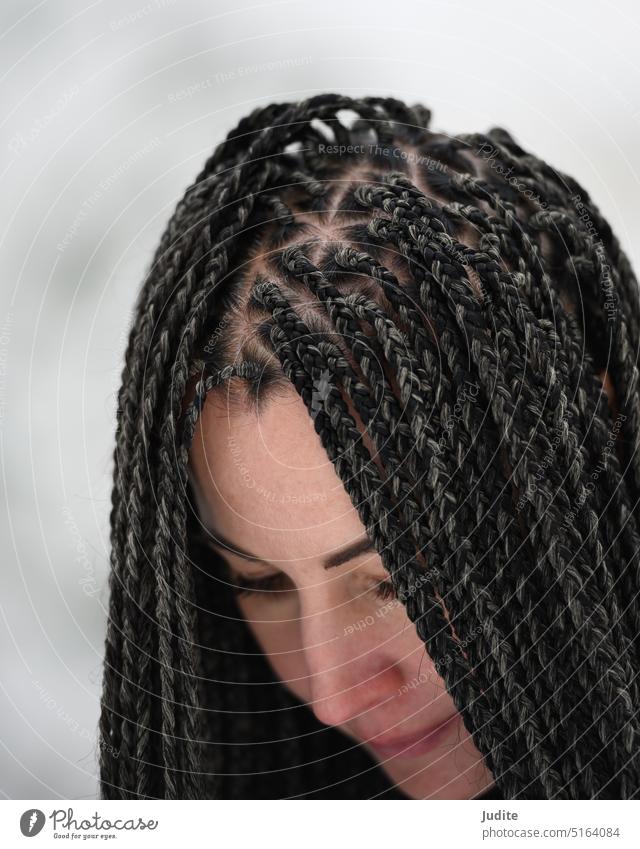 Young woman with African braids in natural winter environment landscape attractive authentic beautiful beauty black candid casual caucasian cheerful cold