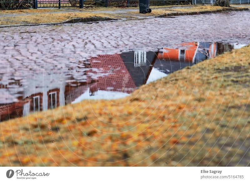 Puddle romance - reflection of a row of houses Reflection Street Exterior shot Deserted House (Residential Structure) Weather Colour photo Building Architecture