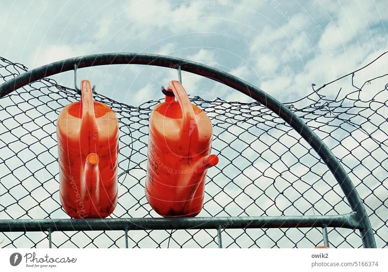 Community of Fate watering cans Hang Cemetery Wire Jug Wired two Red Bright Colours bright red Suspended togetherness Wait patience Sky Clouds Framework