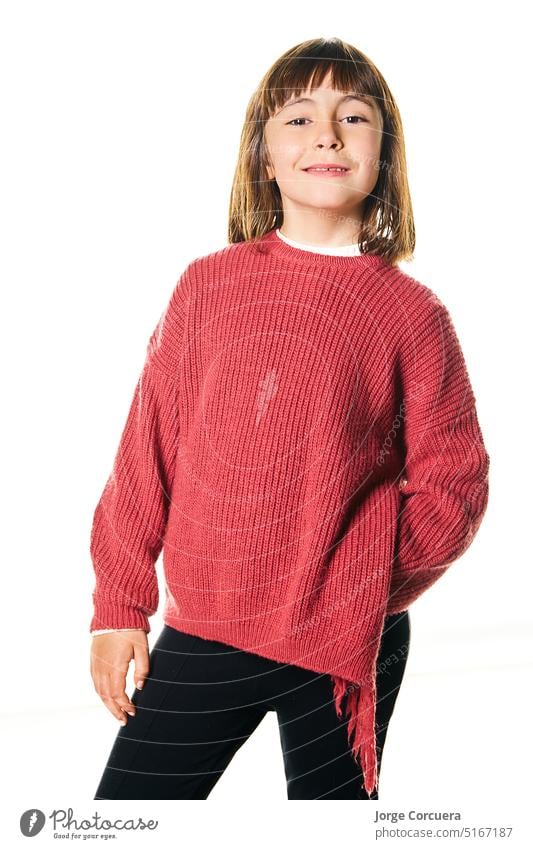 American flat portrait of a 6-year-old school-age girl looking at the camera with straight hair. posing in studio. Insolated white background expressing one