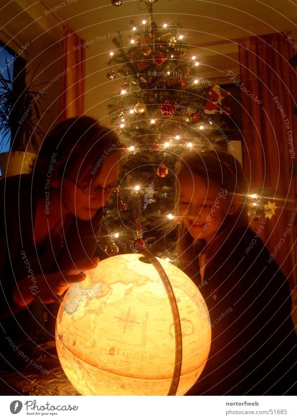 Christmas spirit is reflected in the laughter of a child Warm light Globe Moody Fir tree Gift Child Mother Christmas & Advent Light Earth Feasts & Celebrations