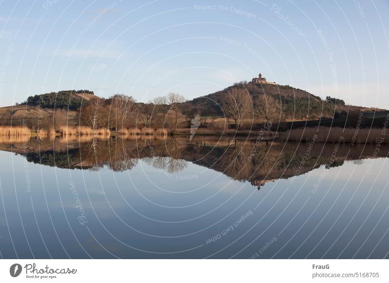 Parallel world | mirrored in water Landscape Lake Water clear Calm Hill castle wachsenburg reflection Beautiful weather Nature Sky Reflection Winter Idyll trees