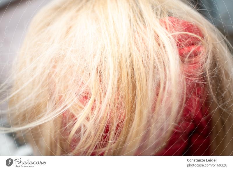 Red blonde hair on red jacket Wind Child Hair and hairstyles Blonde