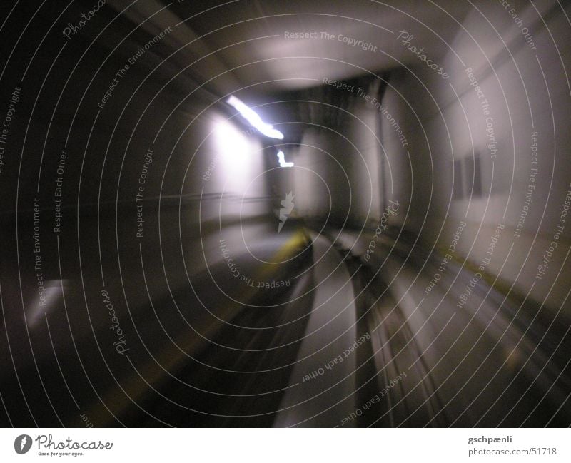 tunnels Dark Speed Railroad Railroad tracks Underground Neon light Cold Heartless Yellow Stripe Long exposure Motion blur Dynamics Curve Distorted Movement