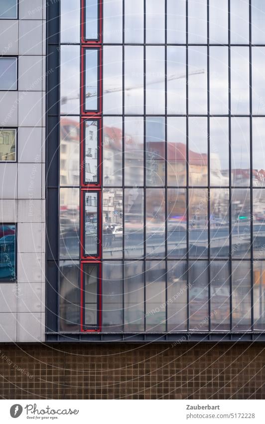 Street bridge and metropolitan house facades of the Wilhelminian period are reflected in the window front of a modern office building Facade Glass Glas facade