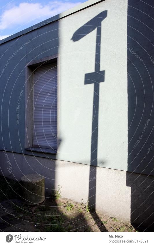 Light and shadow Shadow house wall Window street sign Facade House (Residential Structure) Gloomy Light and shadow play Silhouette Structures and shapes