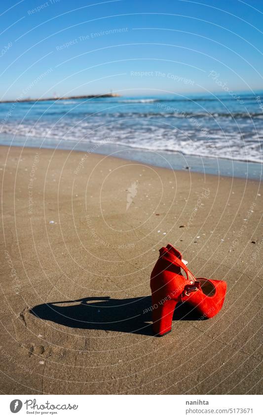 Red high heels  with retro style abandoned in a seashore near the sea freedom fashion missing shoes woman thriller alone run away left over vintage mystery flee