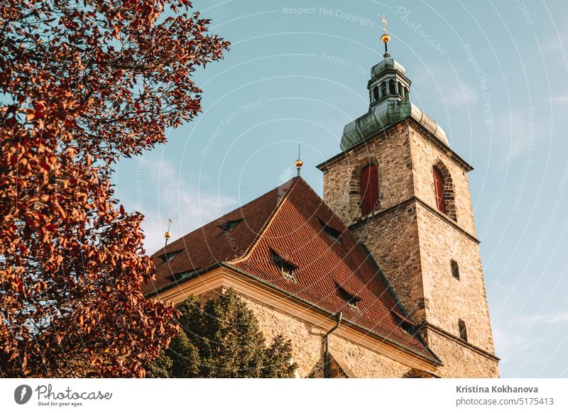 Church of St Henry and St Kunhuta in Prague. Autumn season, orange tree. Bohemia architecture building church city prague travel czech old tourism tower town