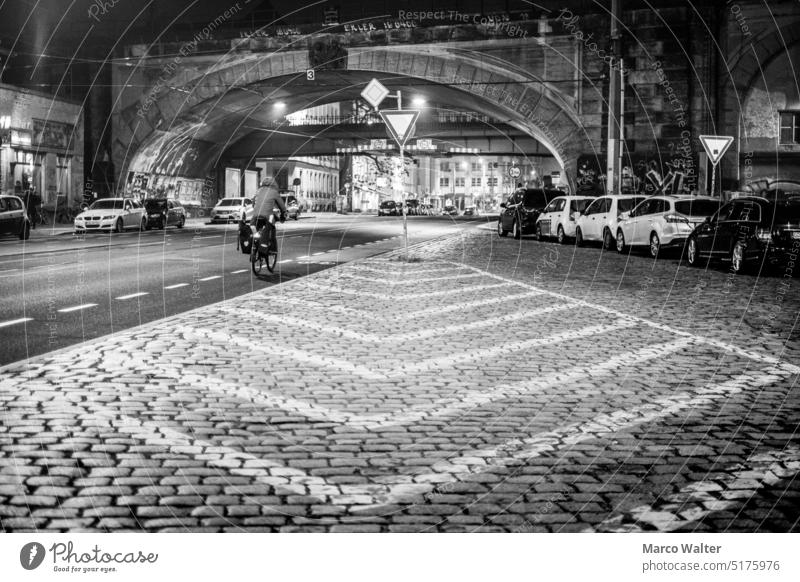 Road symmetry Street Road traffic Bicycle Traffic infrastructure Lanes & trails Exterior shot Cycle path Town Means of transport Symmetry Road marking Bridge