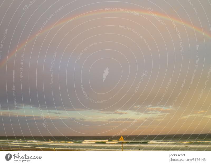 a rainbow stretches across the pacific ocean Rainbow Sky Clouds after the rain Nature Summer Climate Sunlight Light (Natural Phenomenon) Evening Authentic