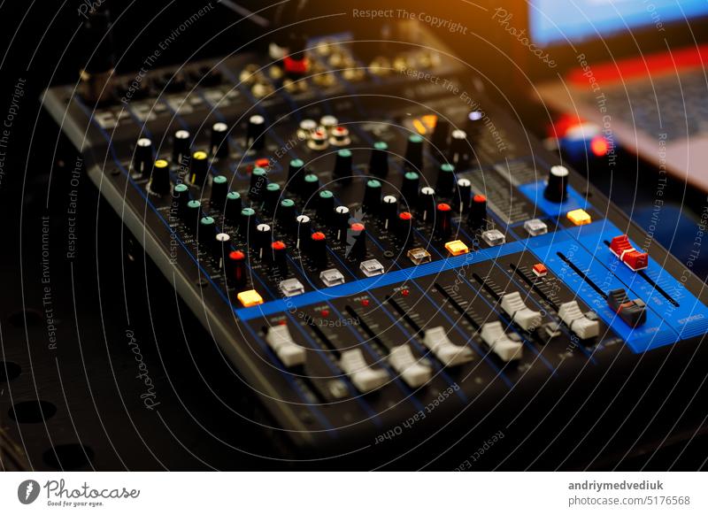 Concert sound mixer panel with volume regulators. Professional audio and light equipment for sound recording studio, live music broadcasting, television, party. mixing console. audio signals