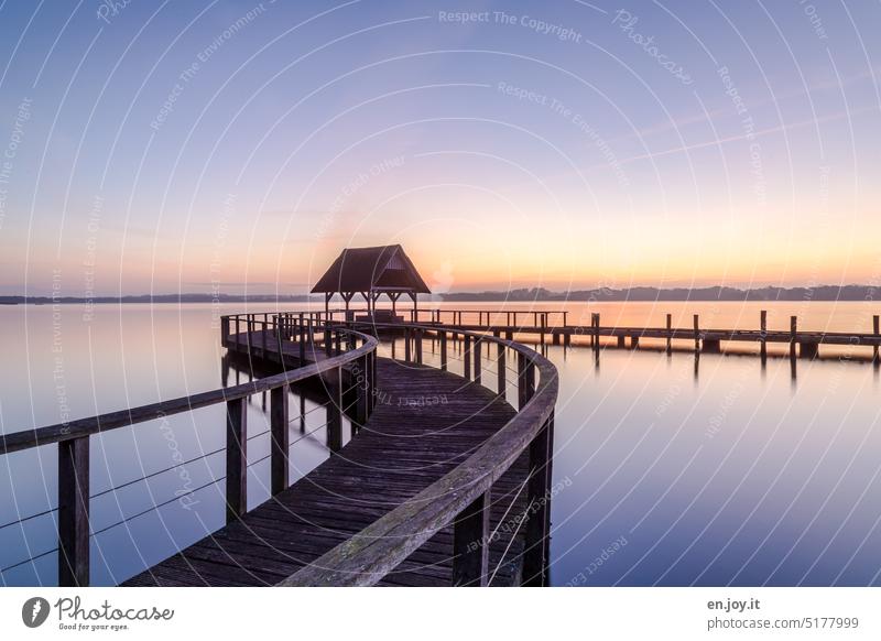 Wooden jetty on the lake before sunrise wooden walkway Footbridge Lake Water Sky Sunrise - Dawn Horizon Blue Calm silent Idyll Reflection Relaxation Deserted