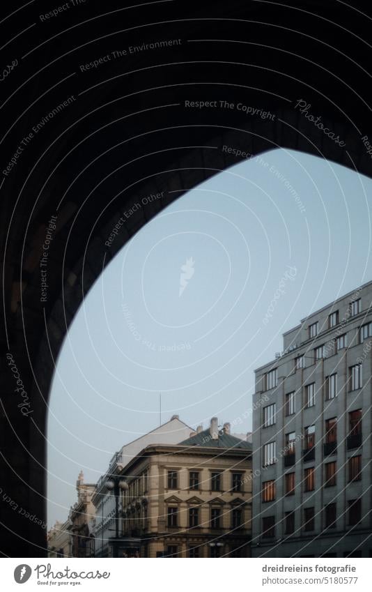 Prague through an archway Old Town Historic Architecture cityscape Czech Republic Tourism Bohemian Forest Sightseeing voyage House (Residential Structure) Sky