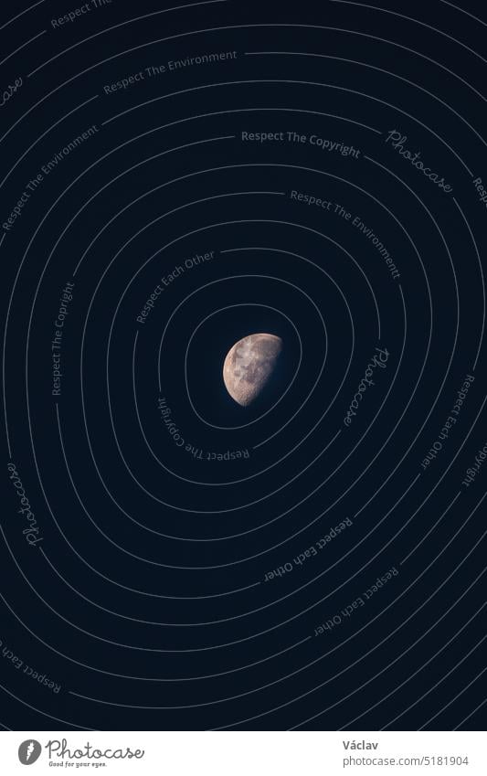 View of the moon halfway to full. A nighttime illuminator of nature. The secret of the white circle full moon astronomy dark artificial no people science