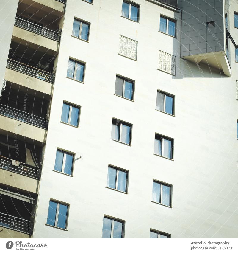 Modern multistory residential building view. urban scene real estate windows perspective outside complex town city concrete condominium blue contemporary glass