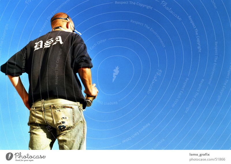 Wall Artist02 Man Respirator mask Dark Exterior shot more youthful spryer Blue sky Graffiti