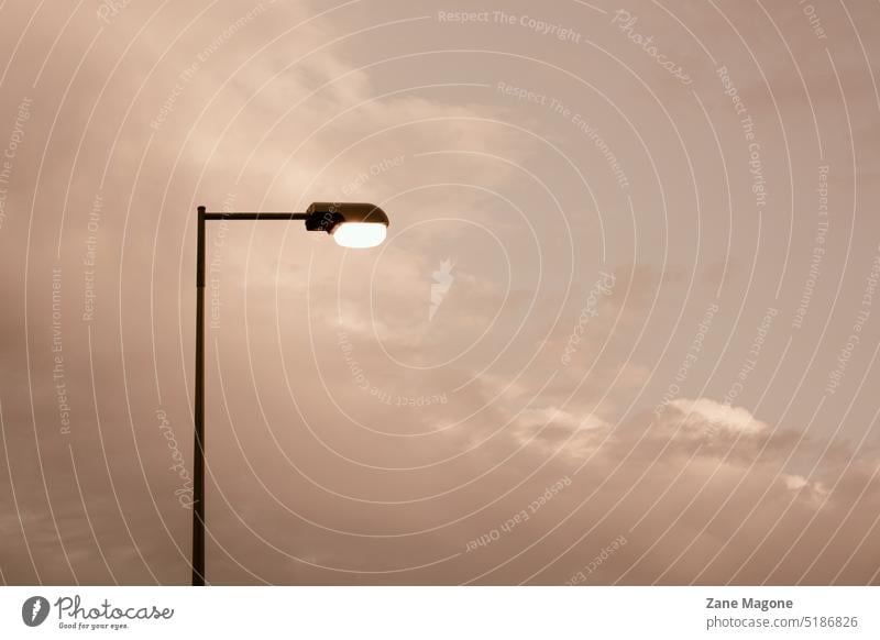 Cloud background with street lamp, minimalist beige infrastructure electricity aesthetic beige sky beige clouds cloudy dreamy surreal empty lonely loneliness