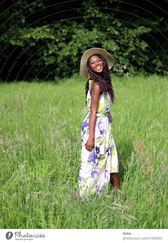 laughing woman with straw hat in a meadow Feminine Woman Park Meadow Dress Hat Long-haired Dark-haired Laughter Stand Joy Happy pretty Happiness Free