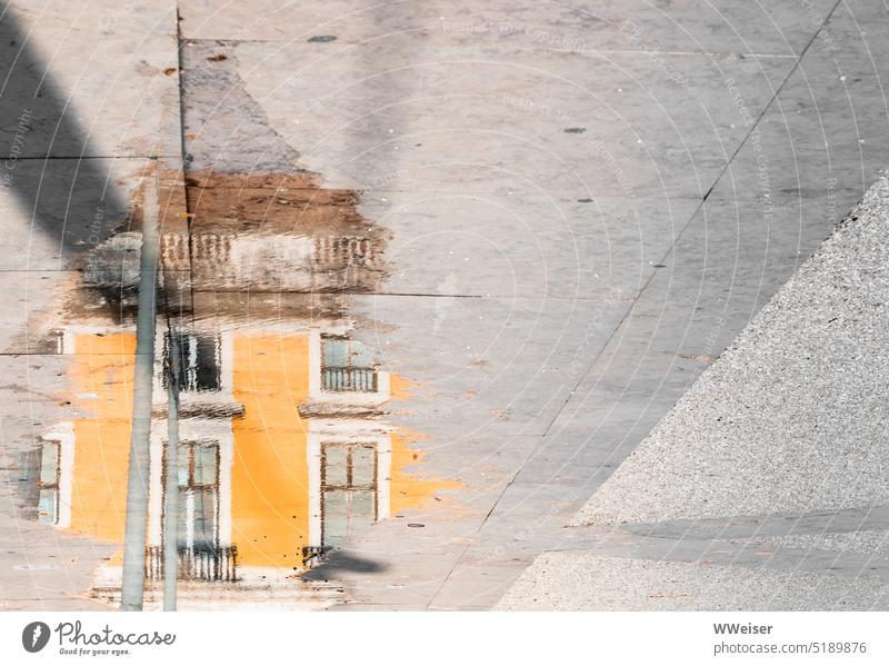 A sunny yellow house is reflected in the puddle, Mediterranean style Puddle Sidewalk Places walkway Facade House (Residential Structure) mirror Reflection Water