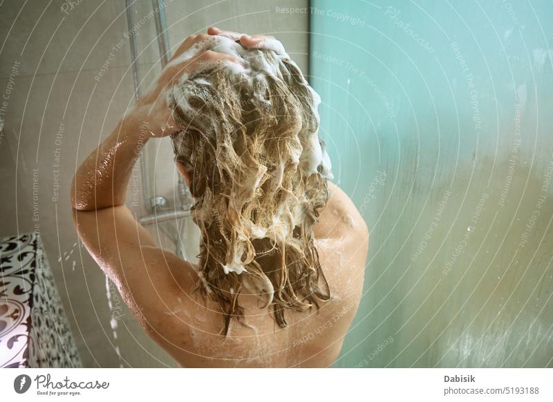 Back view of woman taking a shower in bathroom take back hair hygiene body head clean cabin shampoo washing candid care beauty caucasian enjoy female fresh girl