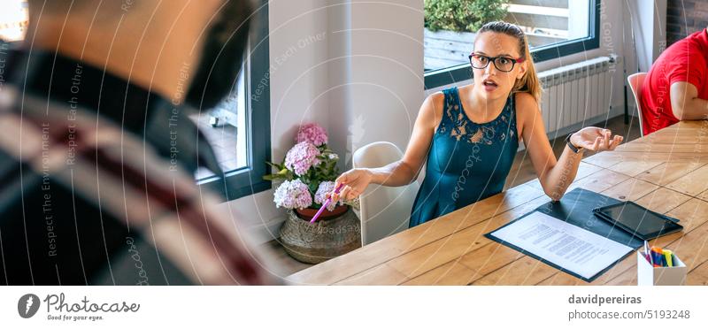 Surprised woman arguing with colleague for problems in coworking female worker discussion quarrel conflict dispute confrontation surprised banner header